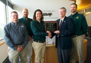 Mike Stone, president-elect of the American Fisheries Society Administration Section, presented a commemorative plaque to Jessica Baumann, the Commission’s fisheries biologist who oversaw the fish attractor study, at the Commission’s May business meeting in Raleigh. Also pictured (L-R): David Hart, Corey Oakley, and Brian McRae.