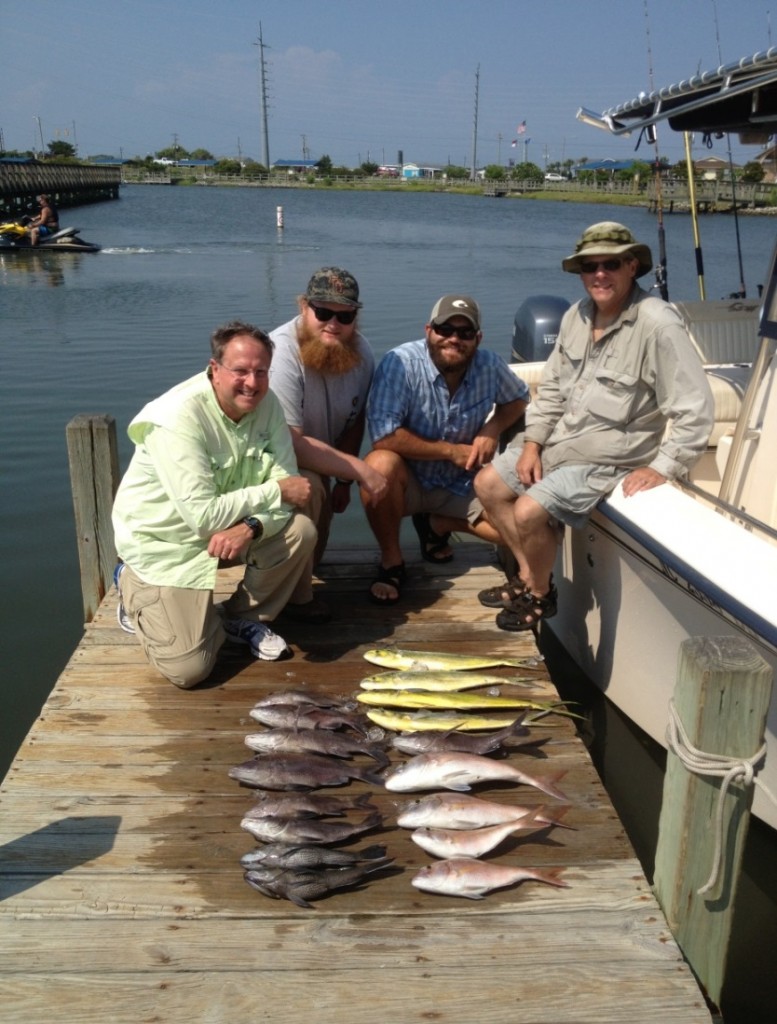 Greg Cope, Bobby Cope, Jesse Fischer, and Tom Kwak (L-R) survive the worst fishing trip ever with Captain Neil Medlin. Don’t bid on this auction item next year!